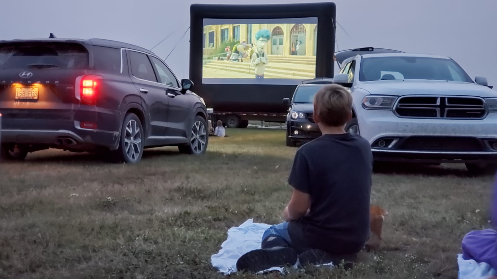 Saskatoon Saskatchewan YXE Pop Up Drive In Movie Screen Outdoor Theatre Cinema Under The Stars Armed With Harmony